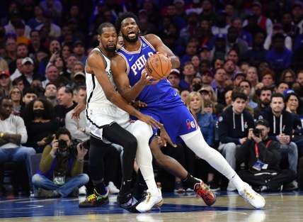 Mar 10, 2022; Philadelphia, Pennsylvania, USA; Philadelphia 76ers center Joel Embiid (21) is fouled by Brooklyn Nets forward Kevin Durant (7) during the first quarter at Wells Fargo Center. Mandatory Credit: Eric Hartline-USA TODAY Sports