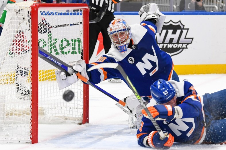 Mar 10, 2022; Elmont, New York, USA;  New York Islanders goaltender Ilya Sorokin (30) dives across the net to make a save against the Columbus Blue Jackets during the first period at UBS Arena. Mandatory Credit: Dennis Schneidler-USA TODAY Sports