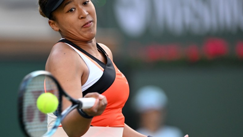 Mar 10, 2022; Indian Wells, CA, USA; Naomi Osaka (JPN) hits a shot in her first round match against Sloane Stephens (not pictured) on day 4 at the BNP Paribas Open at the Indian Wells Tennis Garden. Mandatory Credit: Jayne Kamin-Oncea-USA TODAY Sports