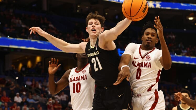Mar 10, 2022; Tampa, FL, USA; Vanderbilt Commodores center Liam Robbins (21) and Alabama Crimson Tide forward Noah Gurley (0) go after the rebound during the first half at Amalie Arena. Mandatory Credit: Kim Klement-USA TODAY Sports