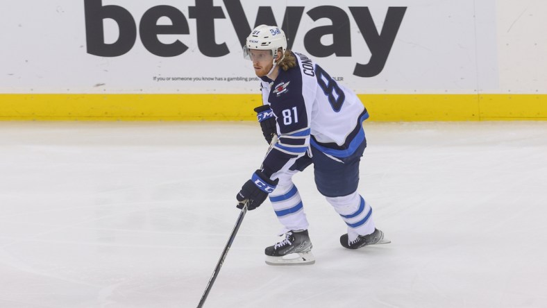 Mar 10, 2022; Newark, New Jersey, USA; Winnipeg Jets left wing Kyle Connor (81) skates with the puck against the New Jersey Devils during the third period at Prudential Center. Mandatory Credit: Ed Mulholland-USA TODAY Sports