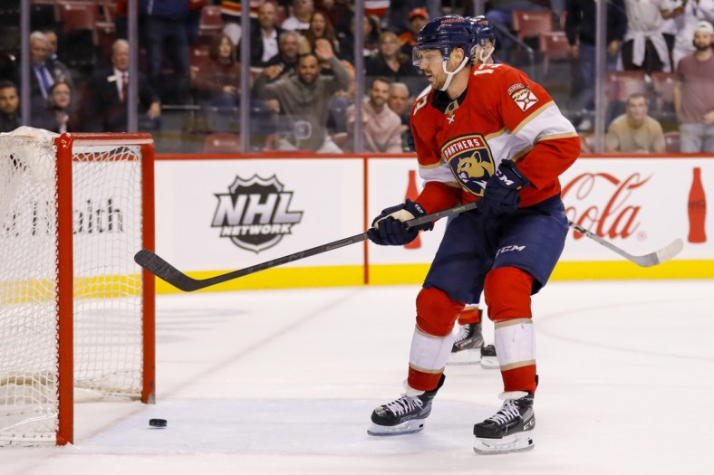 Mar 10, 2022; Sunrise, Florida, USA; Florida Panthers center Sam Reinhart (13) scores on an empty net against the Philadelphia Flyers during the third period at FLA Live Arena. Mandatory Credit: Sam Navarro-USA TODAY Sports
