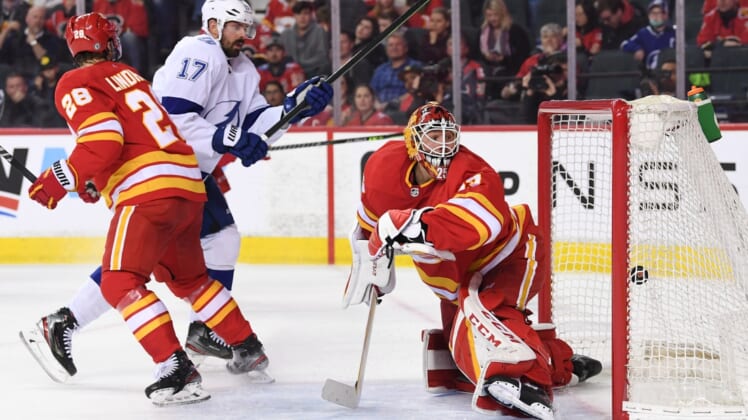 Mar 10, 2022; Calgary, Alberta, CAN; Calgary Flames goalie Jacob Markstrom (25) is scored on by Tampa Bay Lightning forward Alex Killorn (17) during the second period at Scotiabank Saddledome. Mandatory Credit: Candice Ward-USA TODAY Sports