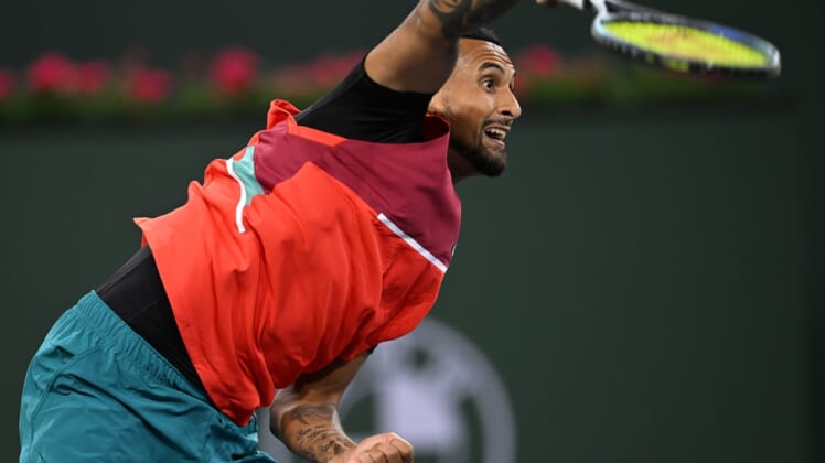Mar 10, 2022; Indian Wells, CA, USA; Nick Kyrgios (AUS) hits a shot in his first round match against Sebastian Baez (not pictured) on day 4 at the BNP Paribas Open at the Indian Wells Tennis Garden. Mandatory Credit: Jayne Kamin-Oncea-USA TODAY Sports