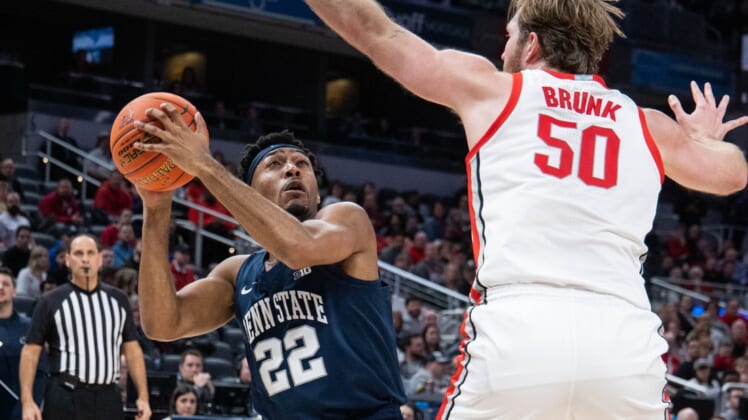 Mar 10, 2022; Indianapolis, IN, USA; Penn State Nittany Lions guard Jalen Pickett (22) looks to shoot the ball while Ohio State Buckeyes center Joey Brunk (50) defends  in the second half at Gainbridge Fieldhouse. Mandatory Credit: Trevor Ruszkowski-USA TODAY Sports