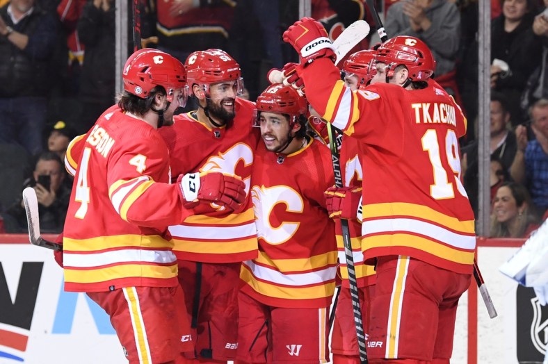 Mar 10, 2022; Calgary, Alberta, CAN; Calgary Flames forward Johnny Gaudreau (13) celebrates his third goal of the game against the Tampa Bay Lightning during the third period at Scotiabank Saddledome. Flames won 4-1. Mandatory Credit: Candice Ward-USA TODAY Sports