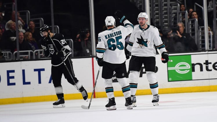 Mar 10, 2022; Los Angeles, California, USA; San Jose Sharks center Tomas Hertl (48) celebrates with defenseman Erik Karlsson (65) his goal scored against the Los Angeles Kings in overtime at Crypto.com Arena. Mandatory Credit: Gary A. Vasquez-USA TODAY Sports