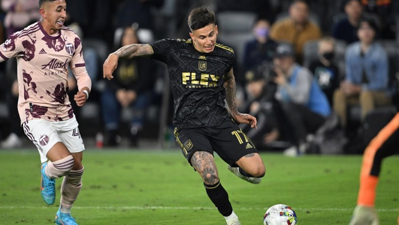 Mar 6, 2022; Los Angeles, California, USA;  Portland Timbers midfielder Marvin Loria (44) looks on as Los Angeles FC midfielder Brian Rodriguez (17) passes the ball to Los Angeles FC defender Mamadou Fall (5) for a goal in stoppage time at Banc of California Stadium. Mandatory Credit: Jayne Kamin-Oncea-USA TODAY Sports