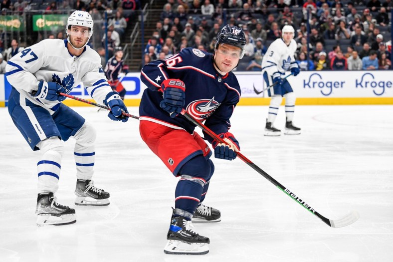 Mar 7, 2022; Columbus, Ohio, USA; Columbus Blue Jackets center Max Domi (16) and Toronto Maple Leafs left wing Pierre Engvall (47) look for the puck in the third period at Nationwide Arena. Mandatory Credit: Gaelen Morse-USA TODAY Sports