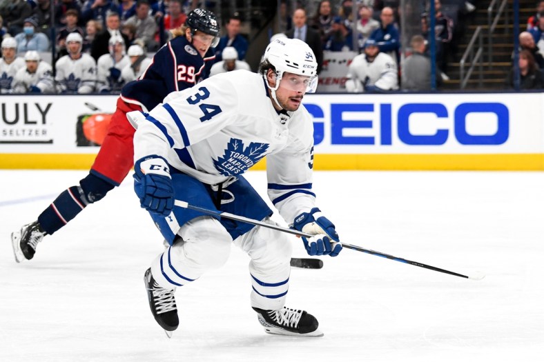 Mar 7, 2022; Columbus, Ohio, USA; Toronto Maple Leafs center Auston Matthews (34) and Columbus Blue Jackets left wing Patrik Laine (29) in the second period at Nationwide Arena. Mandatory Credit: Gaelen Morse-USA TODAY Sports