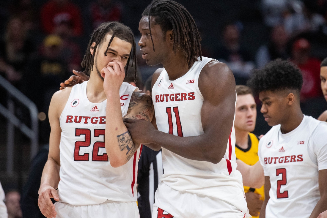 Mar 11, 2022; Indianapolis, IN, USA;  Rutgers Scarlet Knights center Clifford Omoruyi (11) and guard Caleb McConnell (22) talk in the second half against the Iowa Hawkeyes at Gainbridge Fieldhouse. Mandatory Credit: Trevor Ruszkowski-USA TODAY Sports