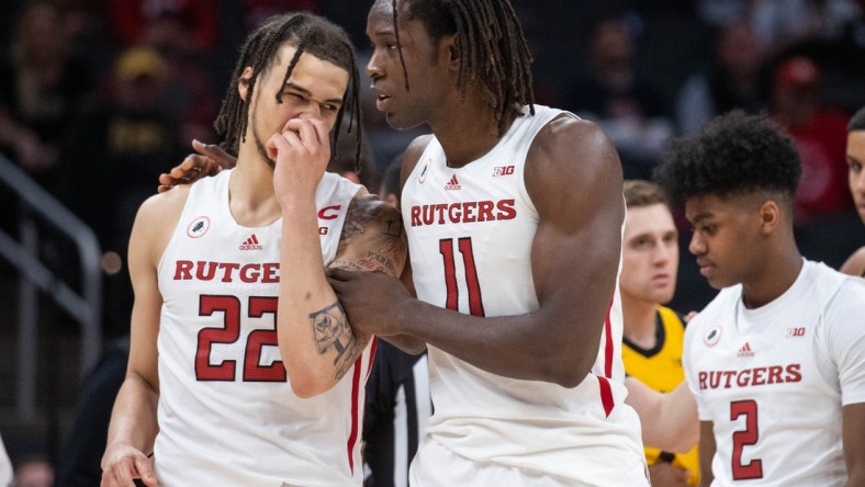 Mar 11, 2022; Indianapolis, IN, USA;  Rutgers Scarlet Knights center Clifford Omoruyi (11) and guard Caleb McConnell (22) talk in the second half against the Iowa Hawkeyes at Gainbridge Fieldhouse. Mandatory Credit: Trevor Ruszkowski-USA TODAY Sports