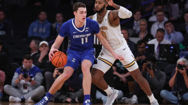 Mar 11, 2022; New York, NY, USA; Creighton Bluejays center Ryan Kalkbrenner (11) dribbles as Providence Friars center Nate Watson (0) defends during the first half at Madison Square Garden. Mandatory Credit: Vincent Carchietta-USA TODAY Sports
