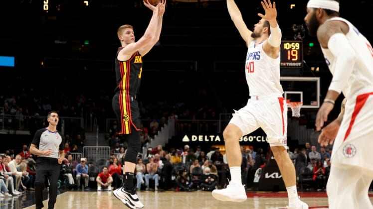 Mar 11, 2022; Atlanta, Georgia, USA; Atlanta Hawks guard Kevin Huerter (3) attempts a three point basket against LA Clippers center Ivica Zubac (40) during the first quarter at State Farm Arena. Mandatory Credit: Jason Getz-USA TODAY Sports