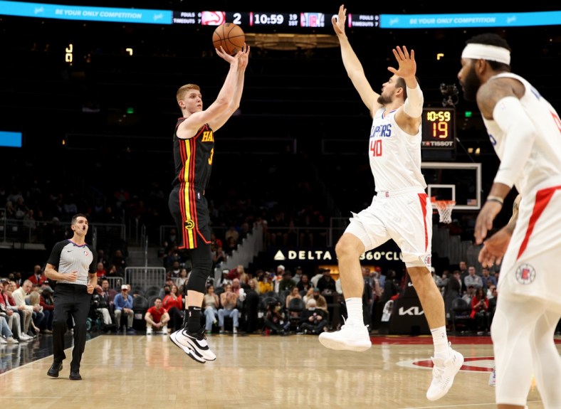 Mar 11, 2022; Atlanta, Georgia, USA; Atlanta Hawks guard Kevin Huerter (3) attempts a three point basket against LA Clippers center Ivica Zubac (40) during the first quarter at State Farm Arena. Mandatory Credit: Jason Getz-USA TODAY Sports
