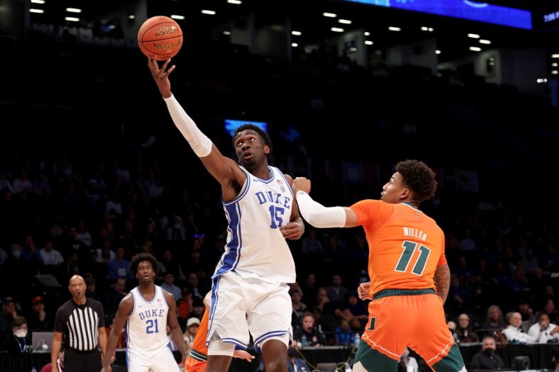 Mar 11, 2022; Brooklyn, NY, USA; Duke Blue Devils center Mark Williams (15) drives to the basket against Miami Hurricanes guard Jordan Miller (11) during the first half of the ACC Tournament semifinal game at Barclays Center. Mandatory Credit: Brad Penner-USA TODAY Sports
