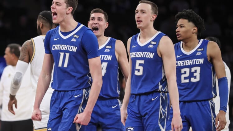 Mar 11, 2022; New York, NY, USA;  Creighton Bluejays center Ryan Kalkbrenner (11) and forward Ryan Hawkins (44) and guards Alex O'Connell (5) and Trey Alexander (23) celebrate after a timeout by the Providence Friars in the second half at the Big East Tournament at Madison Square Garden. Mandatory Credit: Wendell Cruz-USA TODAY Sports