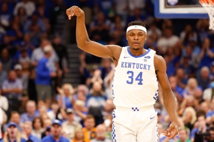 Mar 11, 2022; Tampa, FL, USA;  Kentucky Wildcats forward Oscar Tshiebwe (34) reacts after a basket against the Vanderbilt Commodores at Amelie Arena. Mandatory Credit: Nathan Ray Seebeck-USA TODAY Sports
