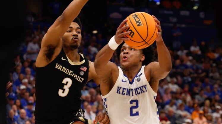 Mar 11, 2022; Tampa, FL, USA;  Kentucky Wildcats guard Sahvir Wheeler (2) drives tot the basket guarded by Vanderbilt Commodores guard Rodney Chatman (3) in the first half at Amelie Arena. Mandatory Credit: Nathan Ray Seebeck-USA TODAY Sports