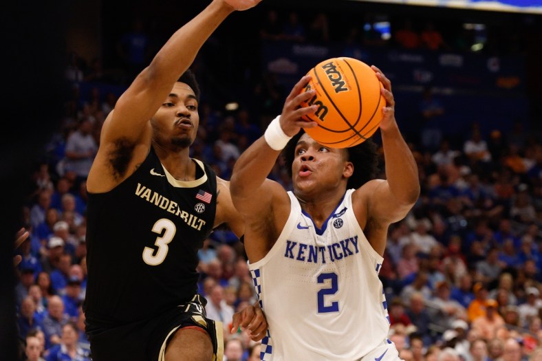 Mar 11, 2022; Tampa, FL, USA;  Kentucky Wildcats guard Sahvir Wheeler (2) drives tot the basket guarded by Vanderbilt Commodores guard Rodney Chatman (3) in the first half at Amelie Arena. Mandatory Credit: Nathan Ray Seebeck-USA TODAY Sports