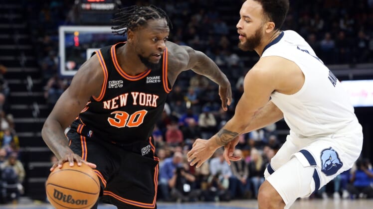 Mar 11, 2022; Memphis, Tennessee, USA; New York Knicks forward Julius Randle (30) drives to the basket as Memphis Grizzlies guard Kyle Anderson (1) defends during the first half at FedExForum. Mandatory Credit: Petre Thomas-USA TODAY Sports
