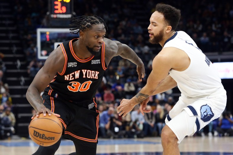 Mar 11, 2022; Memphis, Tennessee, USA; New York Knicks forward Julius Randle (30) drives to the basket as Memphis Grizzlies guard Kyle Anderson (1) defends during the first half at FedExForum. Mandatory Credit: Petre Thomas-USA TODAY Sports