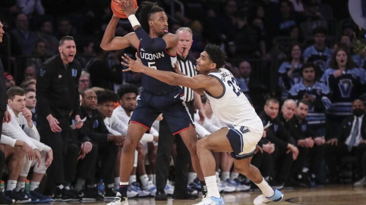 Mar 11, 2022; New York, NY, USA;  Connecticut Huskies forward Isaiah Whaley (5) is guarded by Villanova Wildcats forward Jermaine Samuels (23) in the first half at the Big East Tournament at Madison Square Garden. Mandatory Credit: Wendell Cruz-USA TODAY Sports
