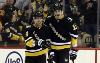 Mar 11, 2022; Pittsburgh, Pennsylvania, USA;  Pittsburgh Penguins center Evan Rodrigues (9) celebrates his goal with center Brian Boyle (11) against the Vegas Golden Knights during the third period at PPG Paints Arena. The Penguins won 5-2.  Mandatory Credit: Charles LeClaire-USA TODAY Sports