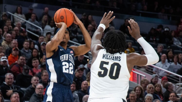 Mar 11, 2022; Indianapolis, IN, USA; Penn State Nittany Lions guard Jalen Pickett (22) shoots the ball while Purdue Boilermakers forward Trevion Williams (50) defends in the first half at Gainbridge Fieldhouse. Mandatory Credit: Trevor Ruszkowski-USA TODAY Sports