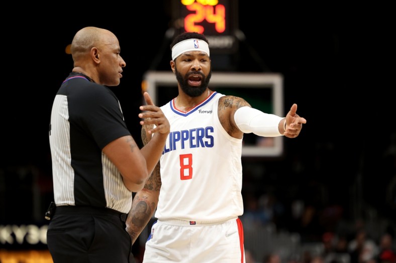 Mar 11, 2022; Atlanta, Georgia, USA; LA Clippers forward Marcus Morris Sr. (8) argues a call with referee Kevin Cutler (34) during their game against the Atlanta Hawks at State Farm Arena. Mandatory Credit: Jason Getz-USA TODAY Sports