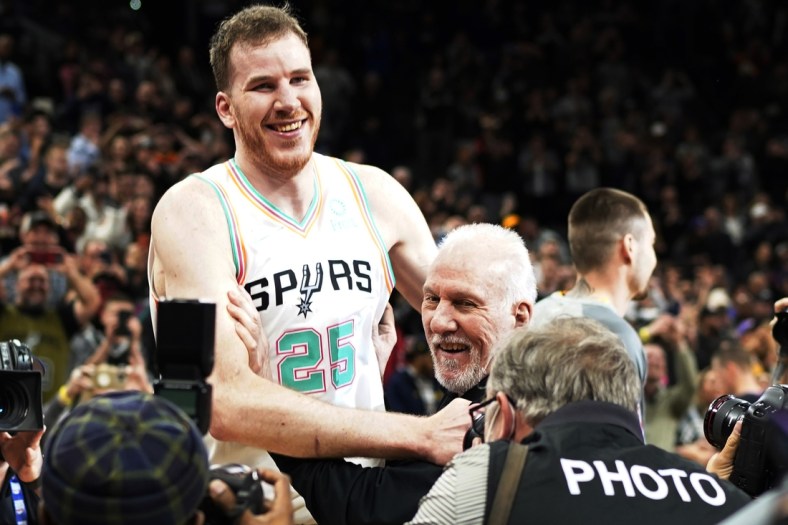 Mar 11, 2022; San Antonio, Texas, USA; San Antonio Spurs head coach Gregg Popovich is congratulated by players after becoming the winningest coach in NBA history after the game against the Utah Jazz at AT&T Center. Mandatory Credit: Scott Wachter-USA TODAY Sports