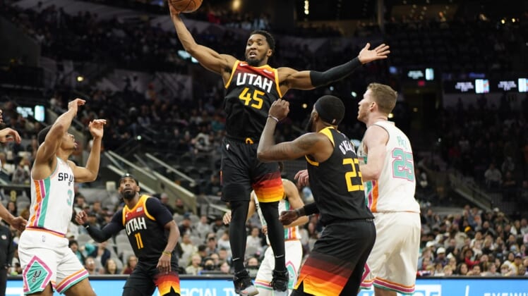 , toppic Mar 11, 2022; San Antonio, Texas, USA; Utah Jazz guard Donovan Mitchell grabs a rebound during the first half against the San Antonio Spurs AT&T Center. Mandatory Credit: Scott Wachter-USA TODAY Sports