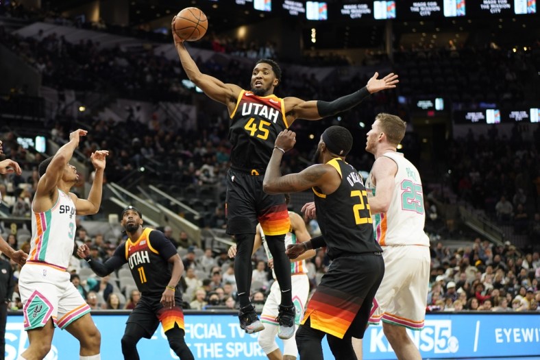 , toppic Mar 11, 2022; San Antonio, Texas, USA; Utah Jazz guard Donovan Mitchell grabs a rebound during the first half against the San Antonio Spurs AT&T Center. Mandatory Credit: Scott Wachter-USA TODAY Sports