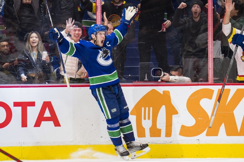 Mar 11, 2022; Vancouver, British Columbia, CAN; Vancouver Canucks forward Bo Horvat (53) celebrates his second goal of the game against the Washington Capitals in the third period at Rogers Arena. Capitals won 4-3 in overtime. Mandatory Credit: Bob Frid-USA TODAY Sports
