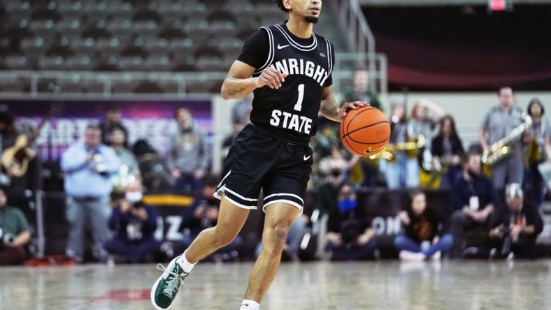 Mar 8, 2022; Indianapolis, IN, USA; Wright State Raiders guard Trey Calvin (1) brings the ball up the court during the first half of the Horizon League championship game between Northern Kentucky and Wright State at Indiana Farmers Coliseum. Mandatory Credit: Robert Goddin-USA TODAY Sports