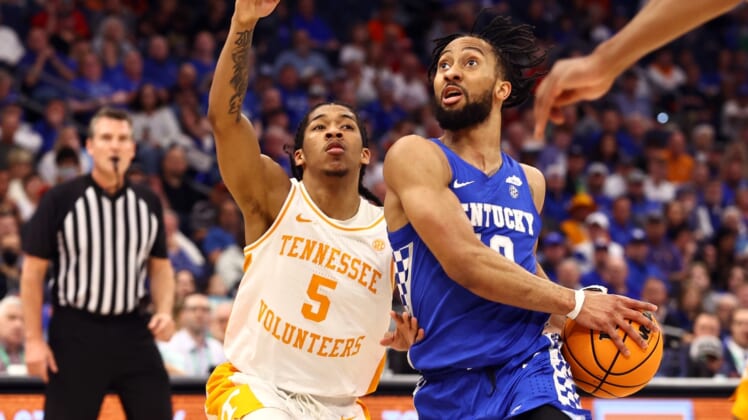 Mar 12, 2022; Tampa, FL, USA; Kentucky Wildcats guard Davion Mintz (10) drives to the basket as Tennessee Volunteers guard Zakai Zeigler (5) defends during the first half at Amalie Arena. Mandatory Credit: Kim Klement-USA TODAY Sports