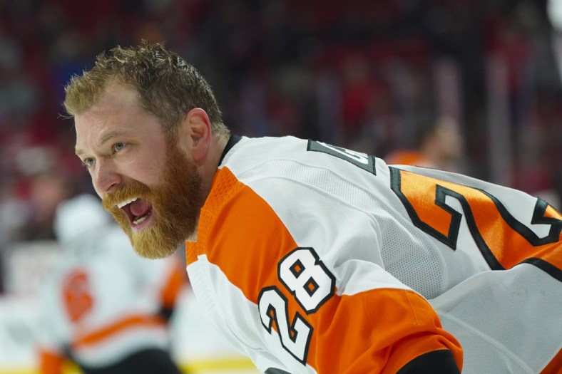 Mar 12, 2022; Raleigh, North Carolina, USA;  Philadelphia Flyers center Claude Giroux (28) reacts against the Carolina Hurricanes before the game at PNC Arena. Mandatory Credit: James Guillory-USA TODAY Sports