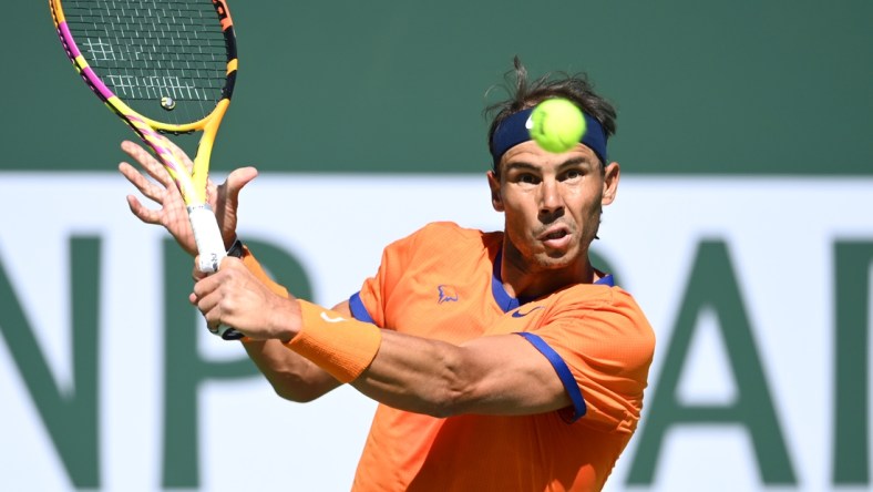 Mar 12, 2022; Indian Wells, CA, USA;  Rafael Nadal (ESP) hits a shot in his 2nd round match defeating Sebastian Korda (USA) at the BNP Paribas open at the Indian Wells Tennis Garden. Mandatory Credit: Jayne Kamin-Oncea-USA TODAY Sports