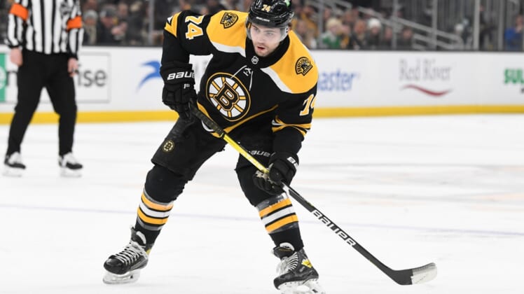 Mar 12, 2022; Boston, Massachusetts, USA; Boston Bruins left wing Jake DeBrusk (74) skates with the puck during the first period of a game against the Arizona Coyotes at the TD Garden. Mandatory Credit: Brian Fluharty-USA TODAY Sports