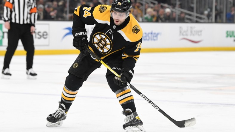 Mar 12, 2022; Boston, Massachusetts, USA; Boston Bruins left wing Jake DeBrusk (74) skates with the puck during the first period of a game against the Arizona Coyotes at the TD Garden. Mandatory Credit: Brian Fluharty-USA TODAY Sports