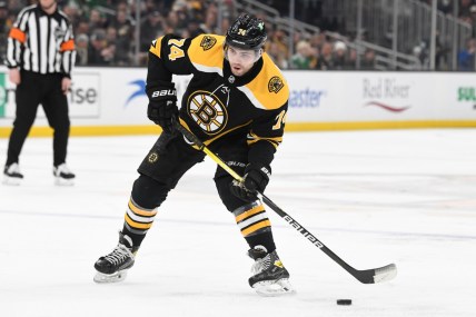Mar 12, 2022; Boston, Massachusetts, USA; Boston Bruins left wing Jake DeBrusk (74) skates with the puck during the first period of a game against the Arizona Coyotes at the TD Garden. Mandatory Credit: Brian Fluharty-USA TODAY Sports
