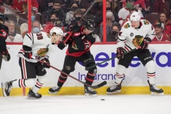 Mar 12, 2022; Ottawa, Ontario, CAN; Chicago Blackhawks left wing Brandon Hagel (38) moves the puck past Ottawa Senators defenseman Thomas Chabot (72) in the first period at the Canadian Tire Centre. Mandatory Credit: Marc DesRosiers-USA TODAY Sports