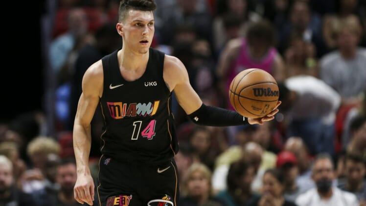 Mar 12, 2022; Miami, Florida, USA; Miami Heat guard Tyler Herro (14) dribbles the basketball during the first quarter of the game against the Minnesota Timberwolves at FTX Arena. Mandatory Credit: Sam Navarro-USA TODAY Sports
