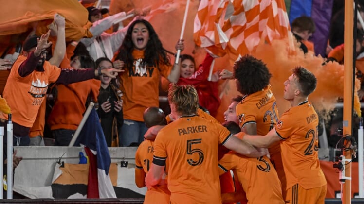 Mar 12, 2022; Houston, Texas, USA;  Houston Dynamo FC forward Darwin Quintero (23) celebrates with teammates after his second goal of the match against the Vancouver Whitecaps at PNC Stadium. Mandatory Credit: Maria Lysaker-USA TODAY Sports