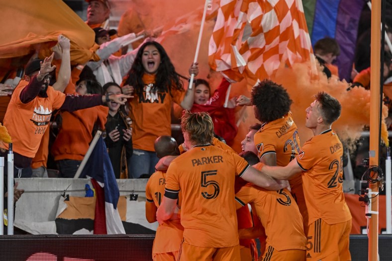 Mar 12, 2022; Houston, Texas, USA;  Houston Dynamo FC forward Darwin Quintero (23) celebrates with teammates after his second goal of the match against the Vancouver Whitecaps at PNC Stadium. Mandatory Credit: Maria Lysaker-USA TODAY Sports