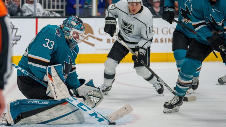 Mar 12, 2022; San Jose, California, USA;  San Jose Sharks goaltender Adin Hill (33) makes a save against the Los Angeles Kings during the second period at SAP Center at San Jose. Mandatory Credit: Neville E. Guard-USA TODAY Sports