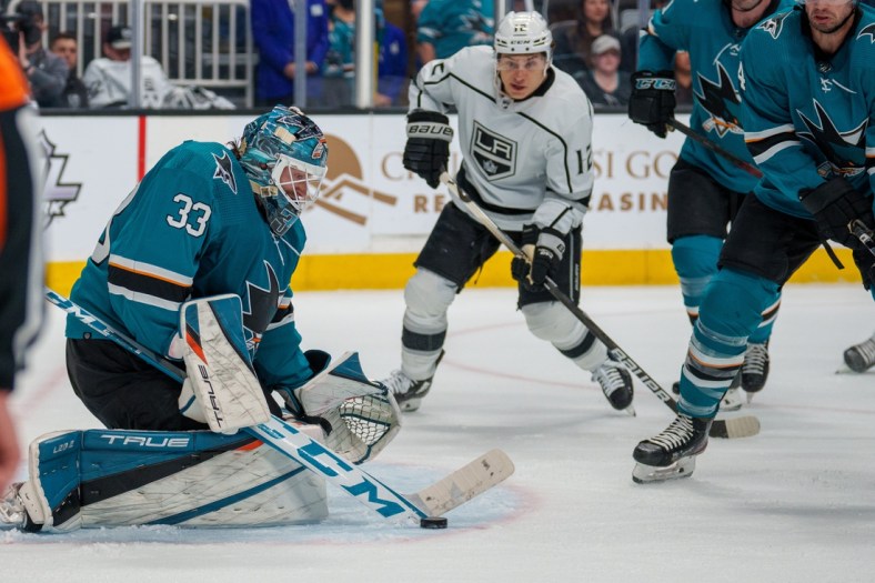 Mar 12, 2022; San Jose, California, USA;  San Jose Sharks goaltender Adin Hill (33) makes a save against the Los Angeles Kings during the second period at SAP Center at San Jose. Mandatory Credit: Neville E. Guard-USA TODAY Sports