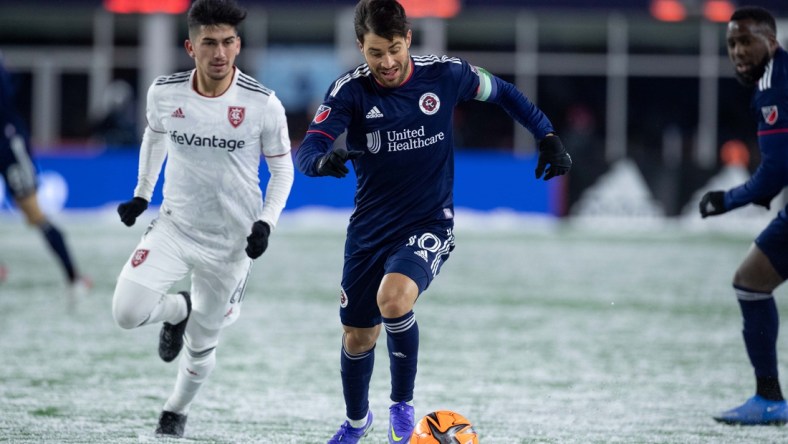 Mar 12, 2022; Foxborough, Massachusetts, USA; New England Revolution midfielder Carles Gil (10) possesses the ball during the second half against Real Salt Lake at Gillette Stadium. Mandatory Credit: Paul Rutherford-USA TODAY Sports