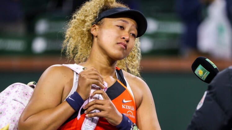 Naomi Osaka of Japan addresses the crowd about being heckled during her match against Veronika Kudermetova of Russia during round two of the BNP Paribas Open at the Indian Wells Tennis Garden in Indian Wells, Calif., Saturday, March 12, 2022.