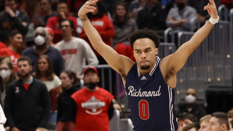 Mar 13, 2022; Washington, D.C., USA; Richmond Spiders guard Jacob Gilyard (0) reacts after making a three pint field goal against the Davidson Wildcats in the first half in the championship game of the Atlantic 10 conference at Capital One Arena. Mandatory Credit: Geoff Burke-USA TODAY Sports